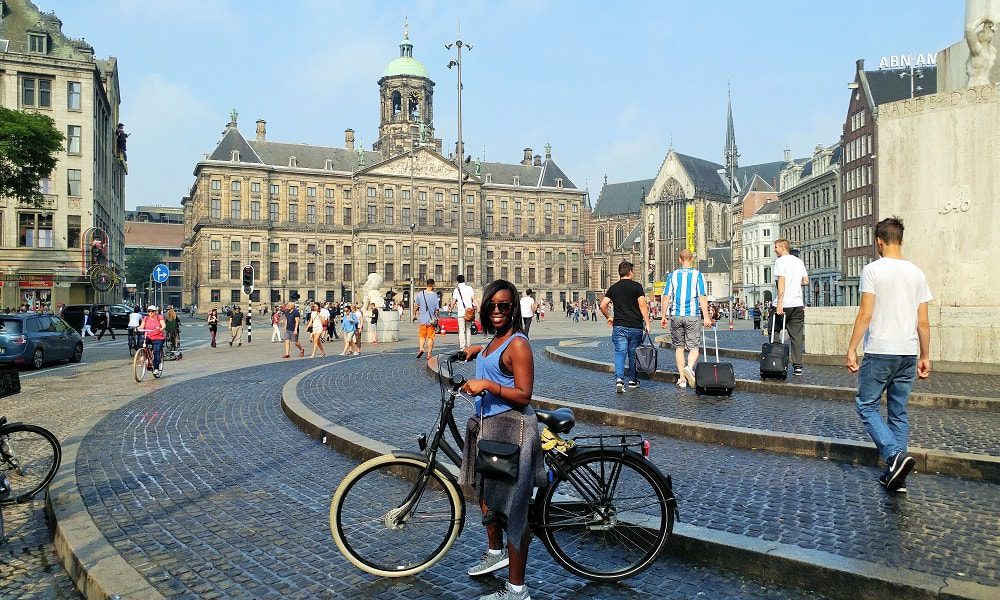 Passing through Dam Square with the bike tour in Amsterdam