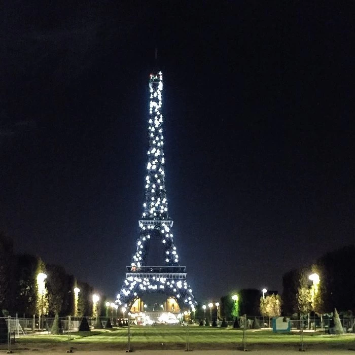 Twinkling lights of the Eiffel Tower at night