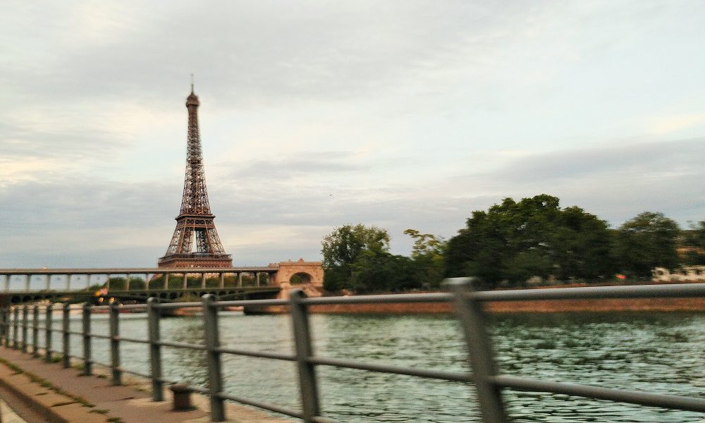 First glimpses of the Eiffel Tower driving along the river