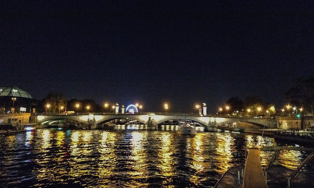 Night boat cruise on the seine river in Paris