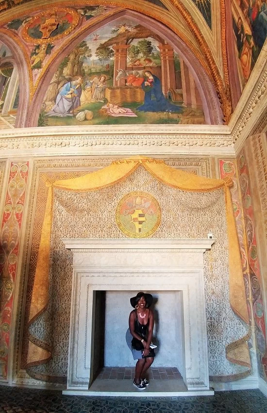 shylo standing under a huge fireplace at the Vatican Museum