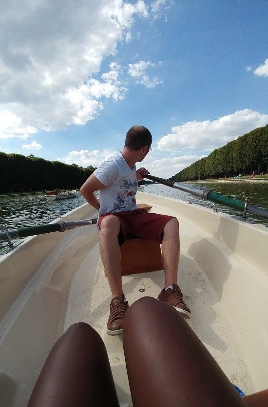Yann rowing a boat on the river at The gardens of Versailles