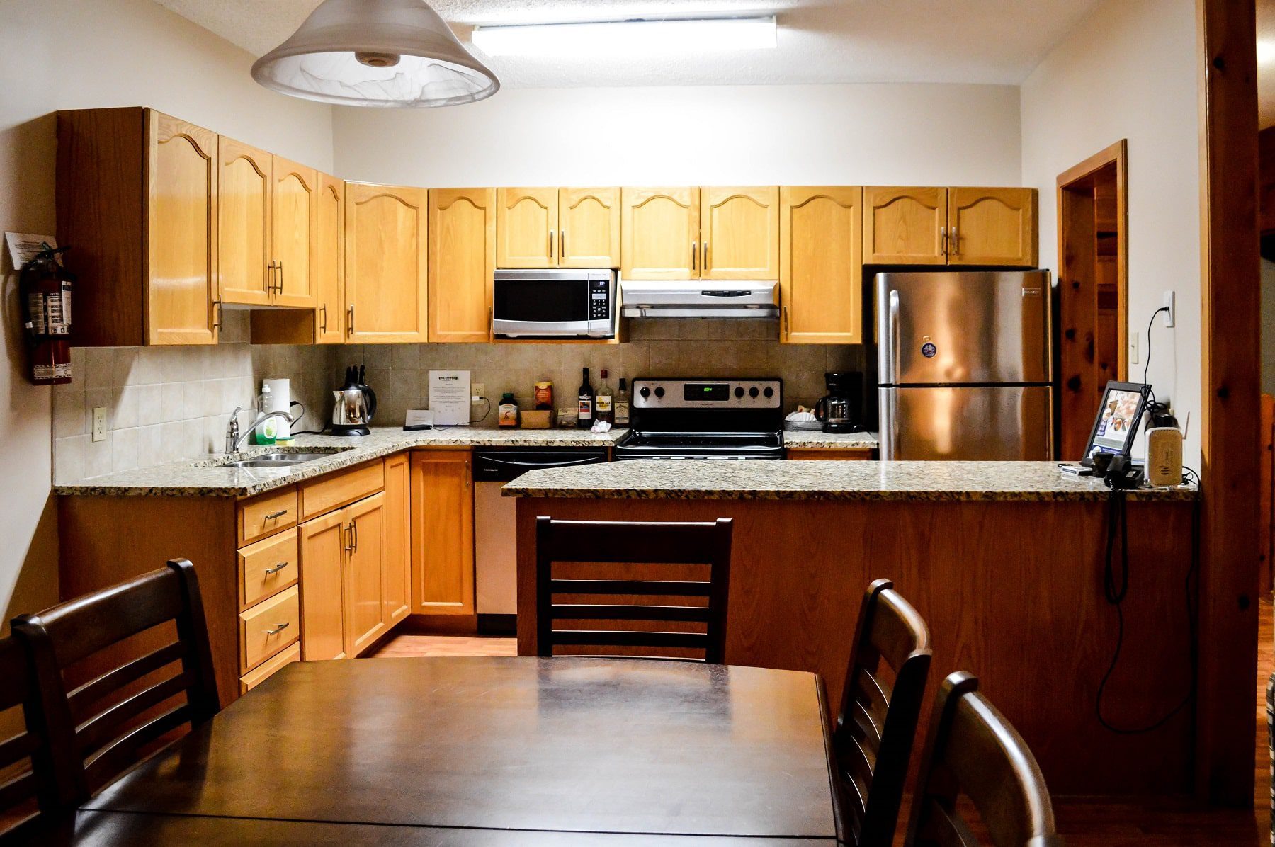 The beautiful wooden kitchen and dining area in the villa