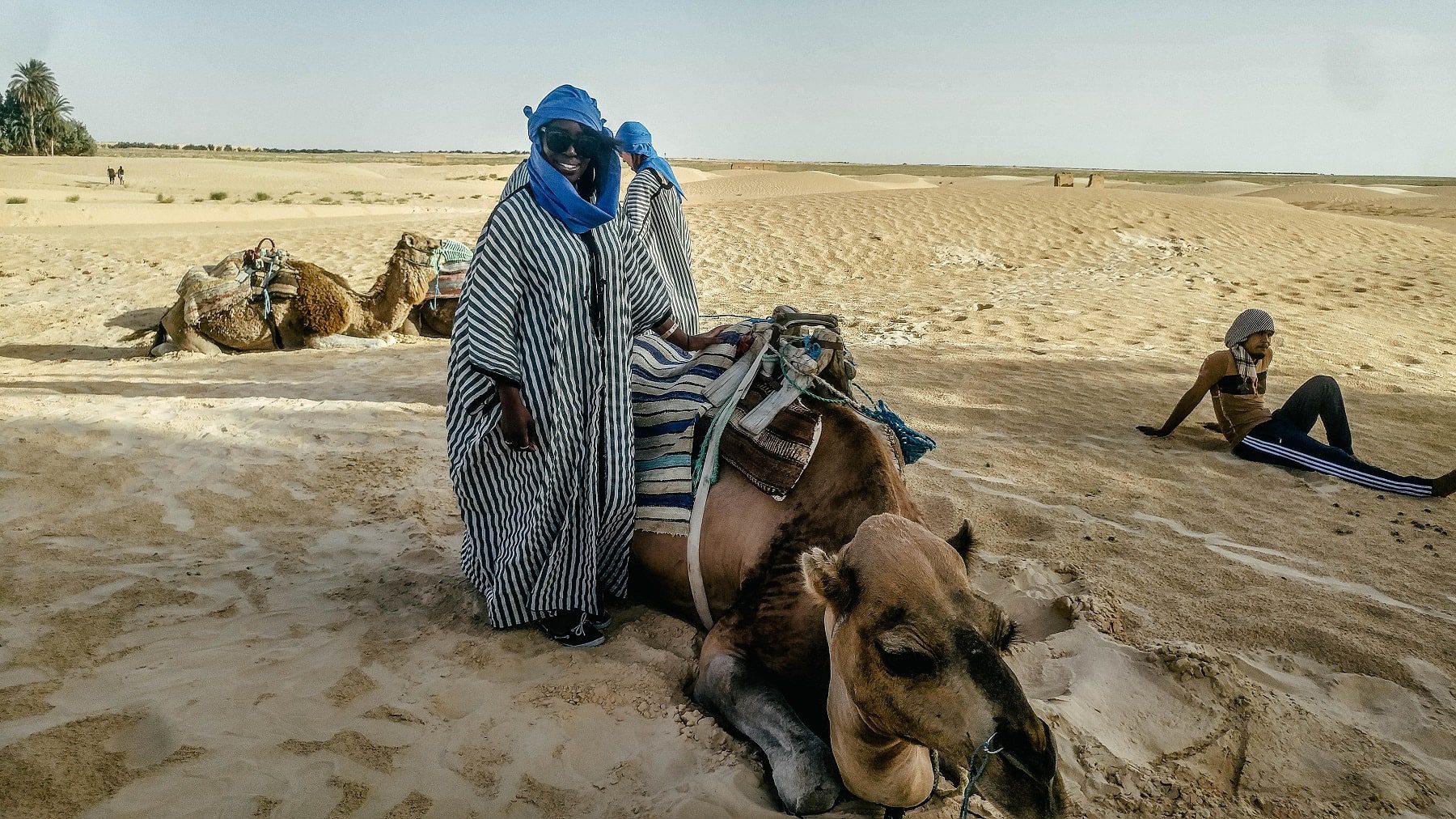 Wearing traditional garb to ride my camel buddy through the desert