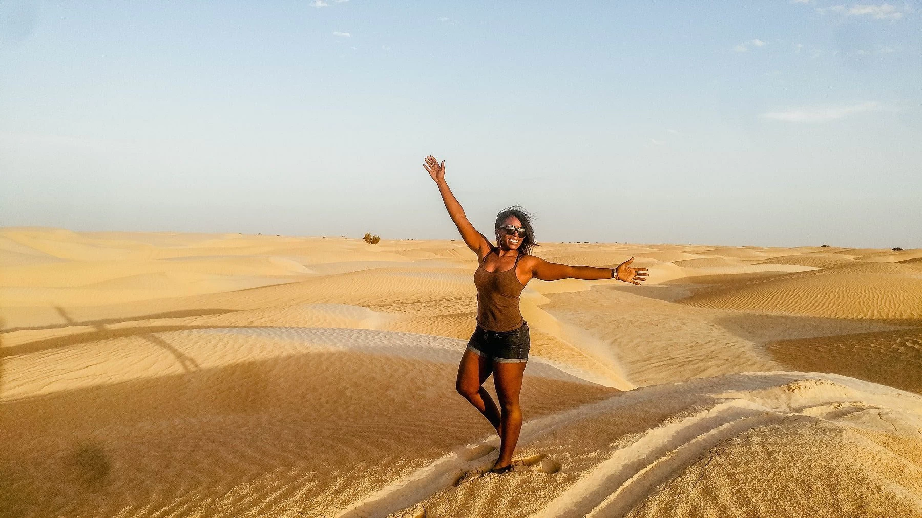 Feeling high on life after running up and down the sand dunes in the Sahara desert