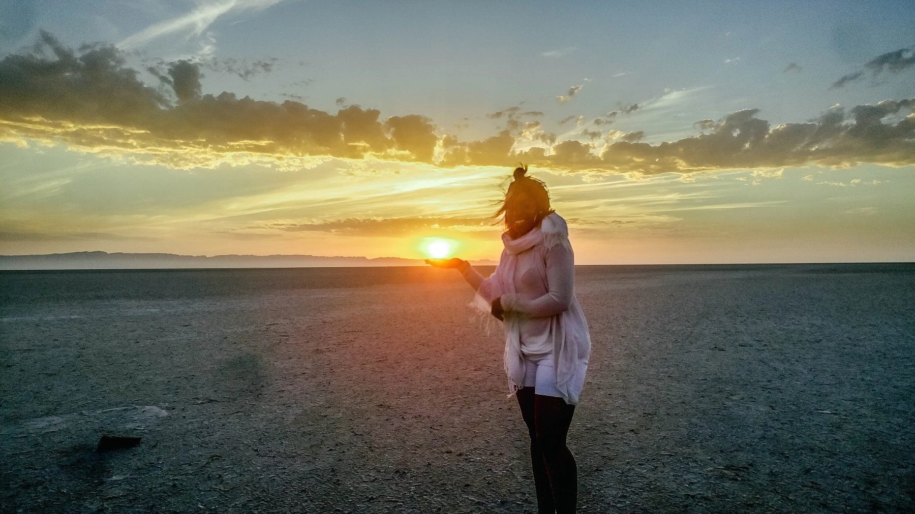 Waking up at 4 am to visit the salt flats and hold the rising sun in my hands