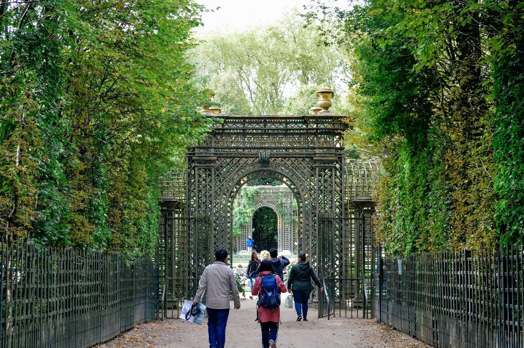 A view of the beautiful trellis walkway in the garden of Versailles