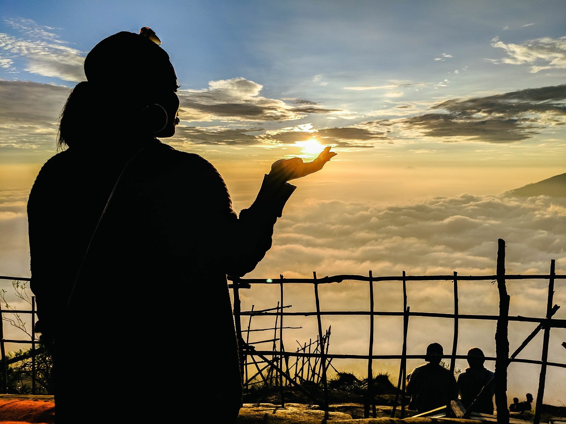 Holding the sun in my hands early in the morning in Bali