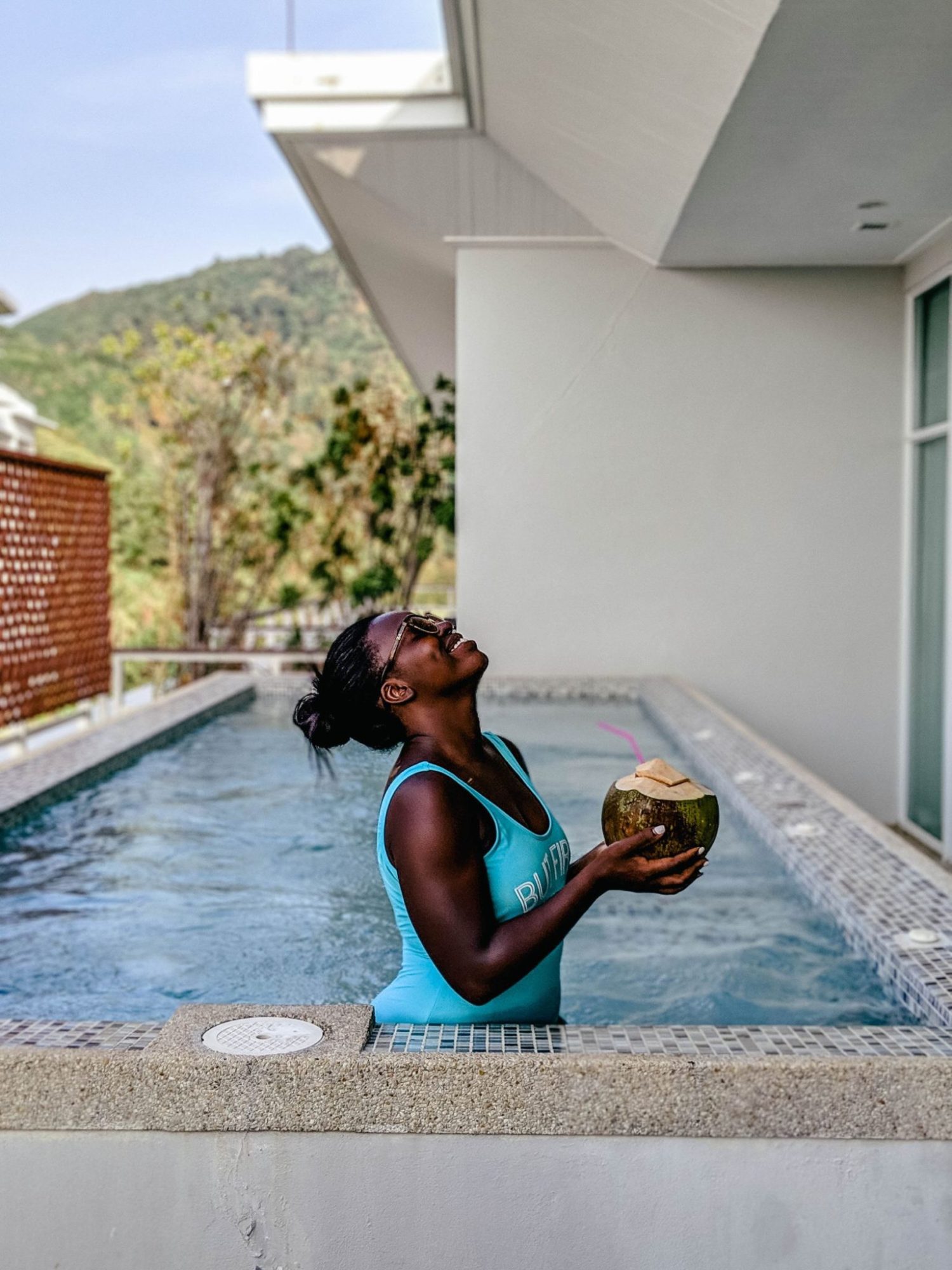 Enjoying my last day in Phuket with a coconut in the private pool of our Airbnb