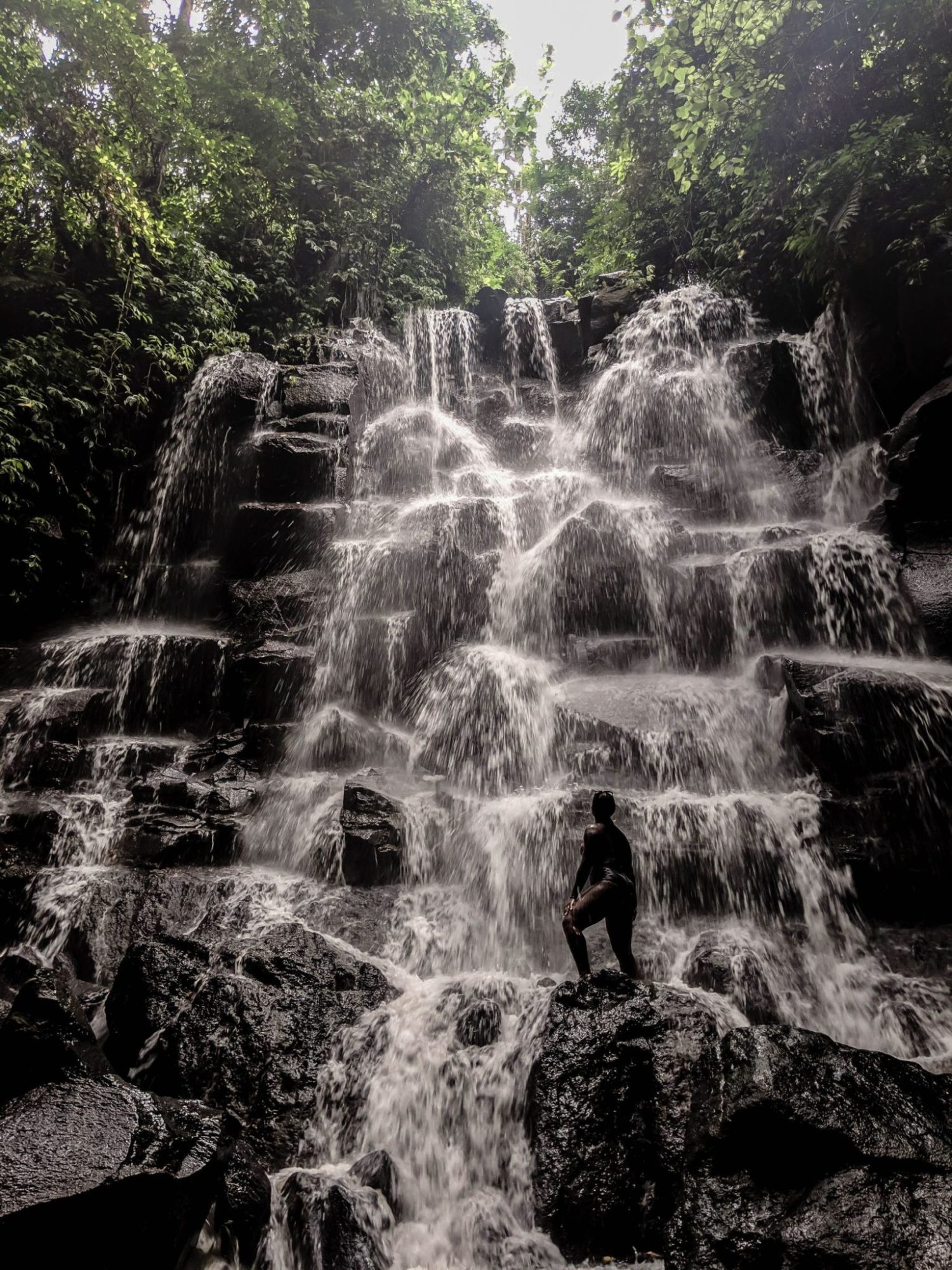 Taking photos in front of the impressive Kanto Lampo falls in Bali